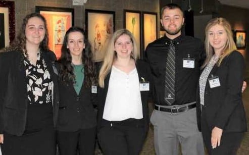 A group of five Michigan Tech students pose at competition.