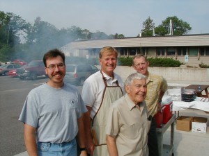 Gene at a School BBQ for the students with (l to r) Jim Schimierer, Glenn Mroz and David Flaspohler