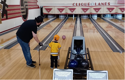 Young boy bowling