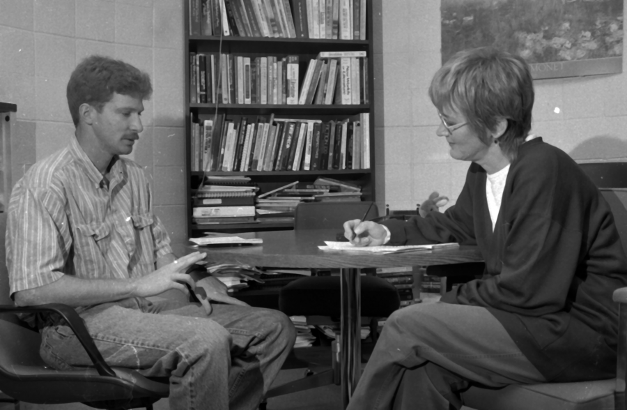 Humanities Professor Emerita Nancy Grimm meets with one of her students in April 1994.