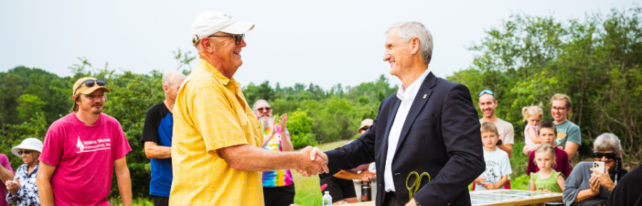 President Rick Koubek cutting the ribbon on the McLean Brownell River Trail