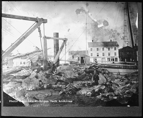 Pieces of mass copper awaiting shipment from the dock at Ontonagon. J.T. Reeder photo, Image MS042-048-999-U644.