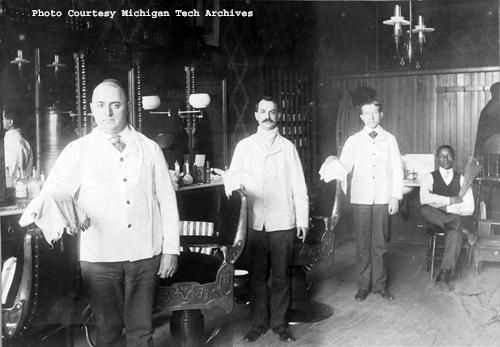Although the lives of local African-Americans settlers to the area are poorly documented, this photograph shows the interior of  a Calumet barbershop and four of its employees. Image #:Nara 42-149