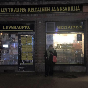 Treating myself after presenting at the International Oral History symposium. Standing in front of Levykauppa Keltainen Jäänsärkijä, a record store in Helsinki, Finland.