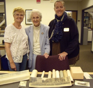 Former archivist, Beth Russell poses with the Raymond family, who donated a collection to Michigan Tech in 2014. 