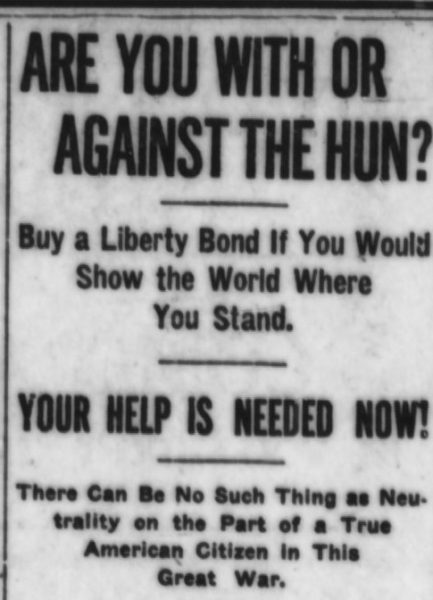 Newspaper with headline: "ARE YOU WITH OR AGAINST THE HUN?"