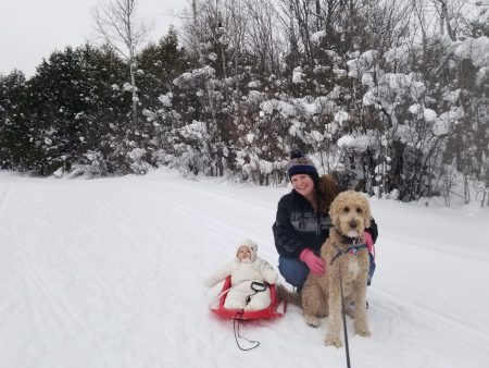 Baby on sled, Sarah holding a large dog