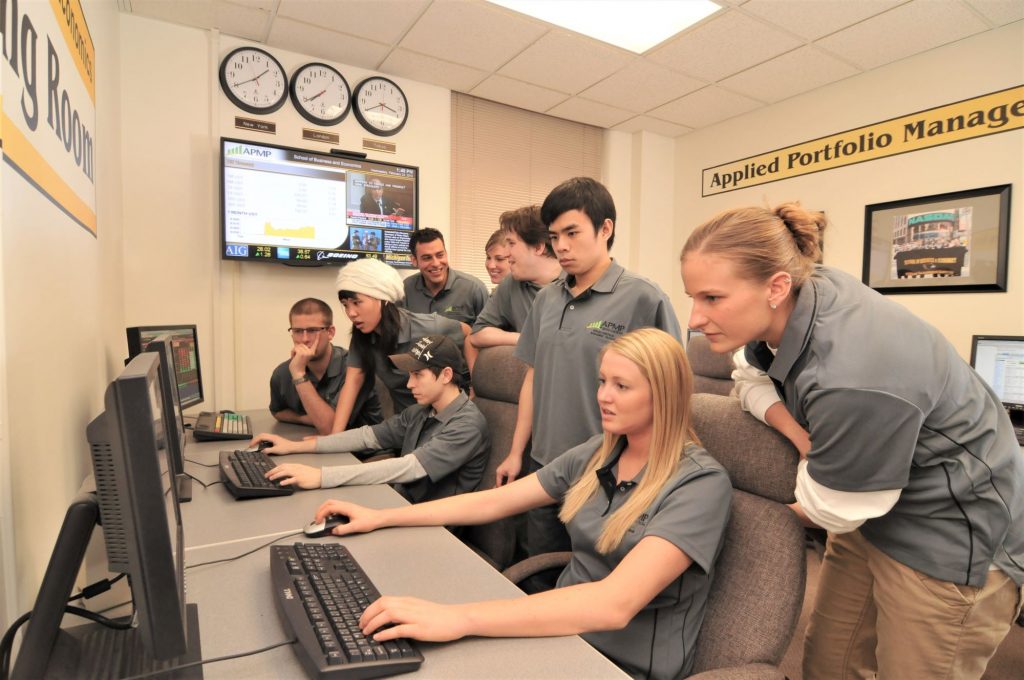 Students gather around computer