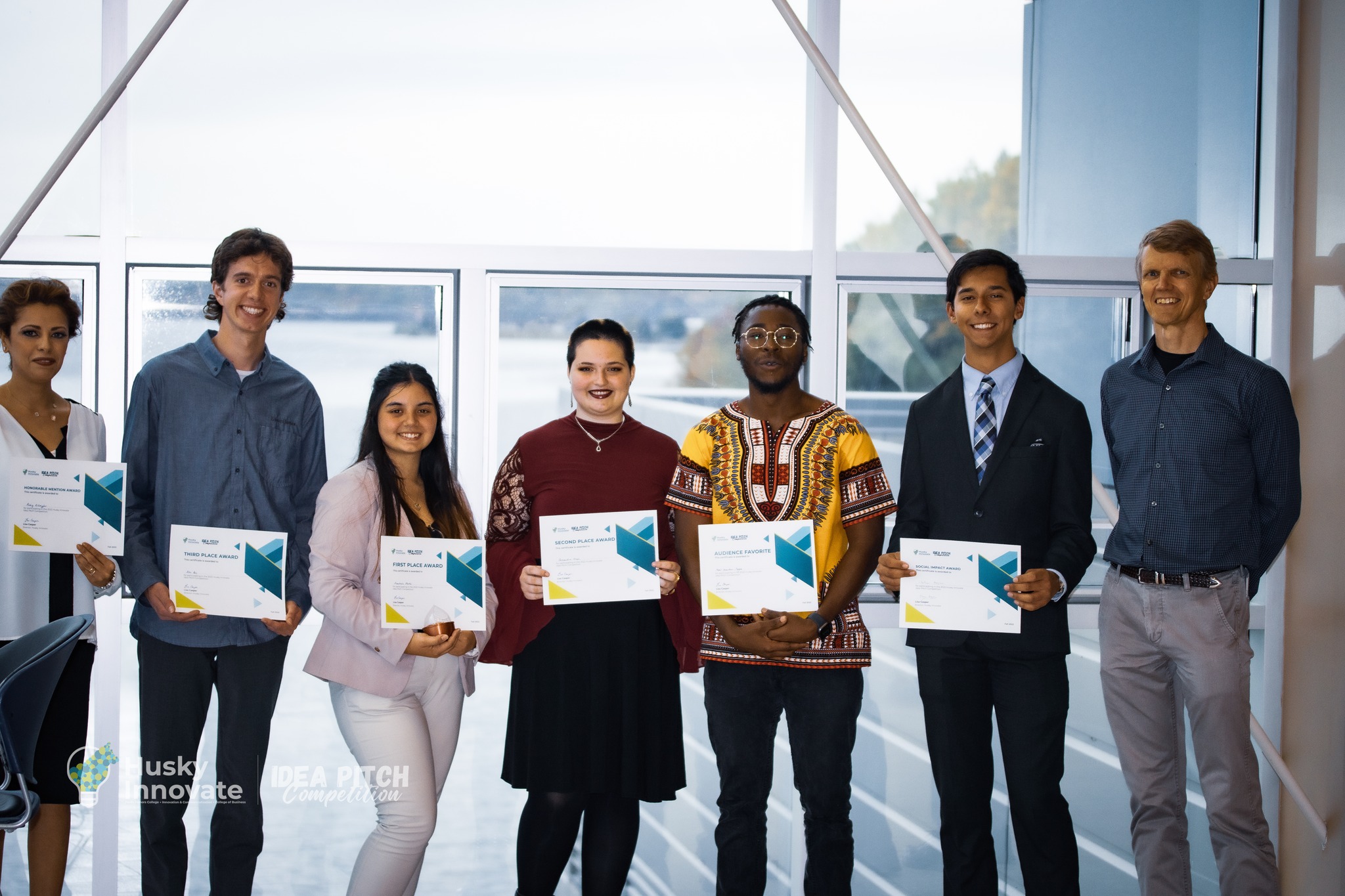 Students winners of the Idea Pitch Competition pose with certificates. 