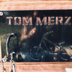 Tom Merz bike plaque on AOB