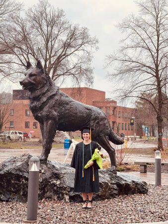Ivy Stoller in front of Husky statue