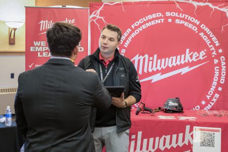 Nathan Sodini, a Milwaukee Tool recruiter and Michigan Tech alumnus, stands on campus smiling while recruiting at the College of Business career fair.