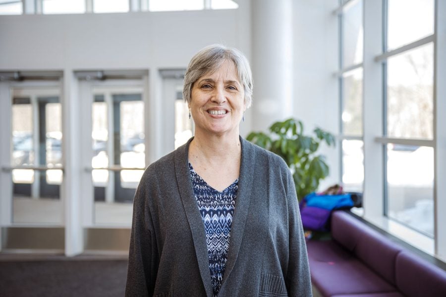 A Michigan Technological University Professor Emeita smiles at the Rozsa Center for the Performing Arts as people gather to celebrate her 30-year career.