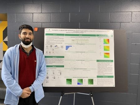 Iman Najafipour by his poster.