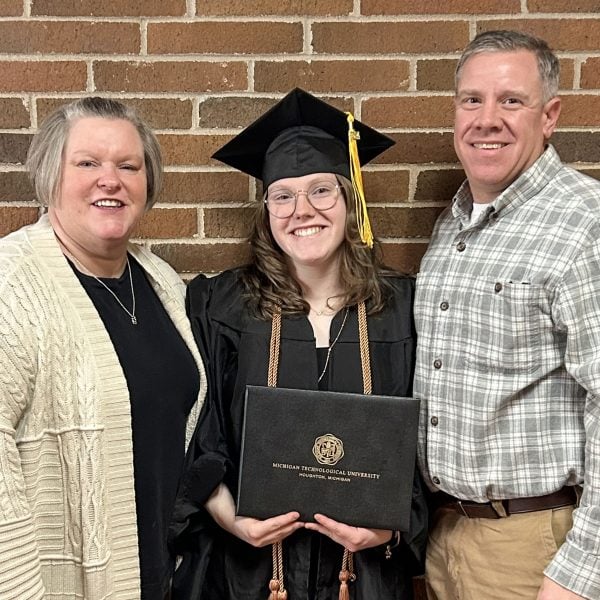 Abby Jurewicz celebrates her achievement with her mom and dad, Amy and Jeff, who also earned their degrees at Michigan Tech. 