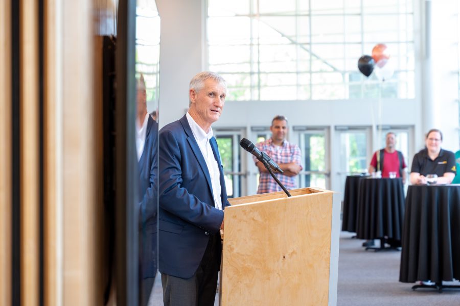 President Rick Koubek at a podium.
