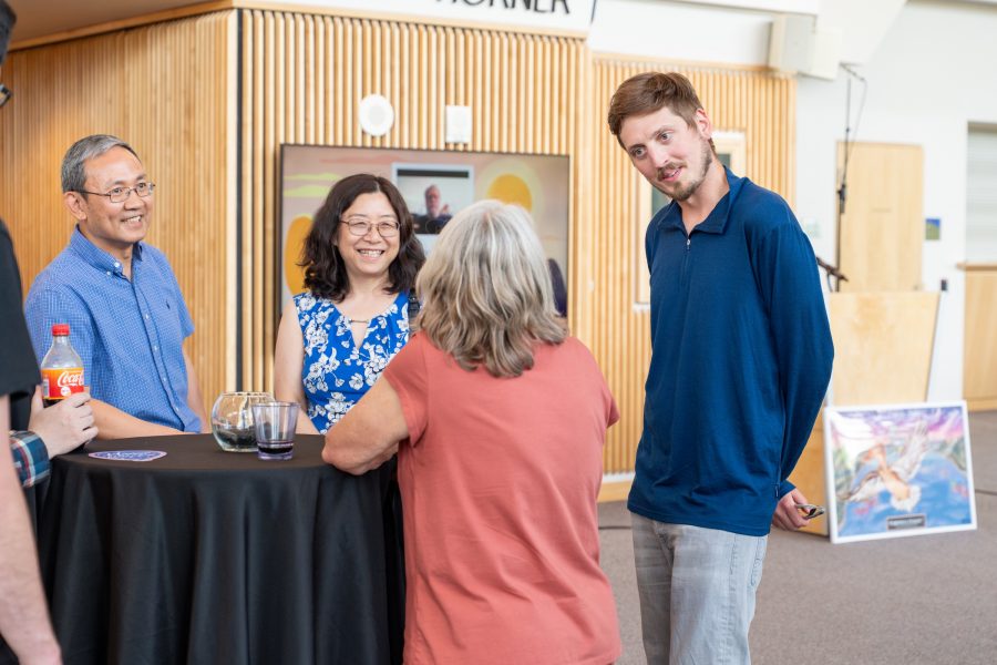 Linda Ott standing at a table with others.