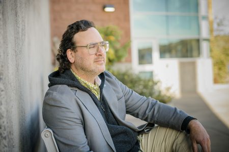 ICC Director Tim Havens looking forward in soft lighting outside the Great Lakes Research Center on the Michigan Tech campus.