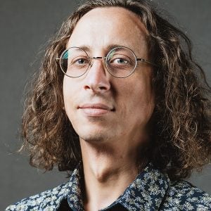 Dr. Evan Lucas' professional headshot in Michigan Tech studio