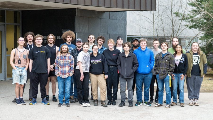 RedTeam president Noah Holland stands with members of Michigan Tech’s student-run cybersecurity organization for a group photo.