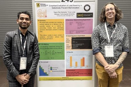 Two Michigan Tech researchers stand before a poster board showing their research on Empirical Evaluation of Loss Masking to Selectively Prevent Memorization.