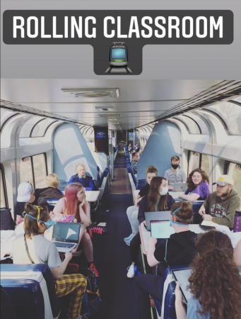 Image of Michigan Tech students sitting on an Amtrak train studying, working and chatting.
