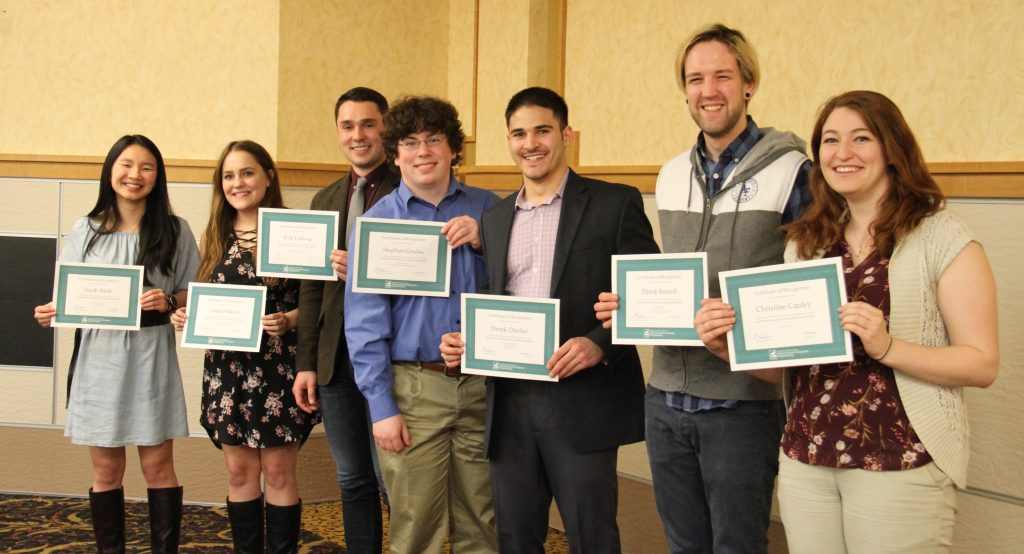 L-R: Sarah Wade, Lanna Pirkola, Kyle Ludwig, Stephen Grulke, Derek Gheller, Derek Burrell, Christine Cauley; Missing from photo: Shaun Flynn, Meghan Friske, Mitchell Paris, Max Pletcher, DeShawn Presley, Jake Soter, Jack Swanberg