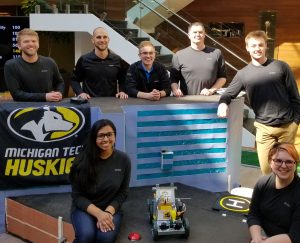 Michigan Tech BME students Emil Johnson, Nicholas Turowski, Melanie Thomas, and Becky Daniels along with mentor Joe Thompson at the 2018 Stryker Engineering Challenge, where they took first place. 