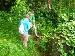 The team designed a stream dam that siphoned water through PVC pipes to five homes that had no water distribution system at all