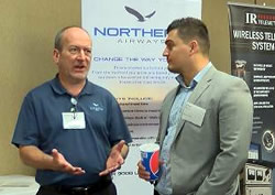 Aerospace Expo 2018 showing participants talking next to posters