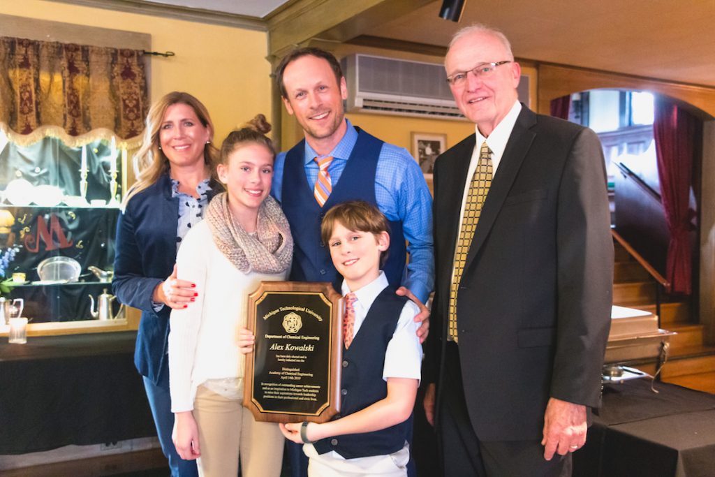 Alex Kowalski, with wife Holly and their two children.