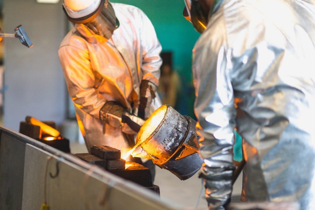 The pouring team fills the molds.