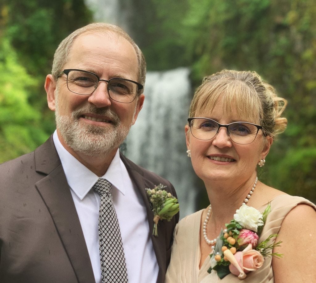 Karl and Christine LaPeer, photo taken at the son's recent wedding standing in front of a waterfall