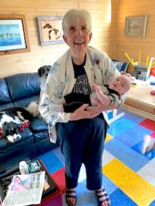 Dr. Sloan holds her infant grandchild