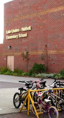 Lake Linden - Hubbell Elementary School exterior with bicycles.