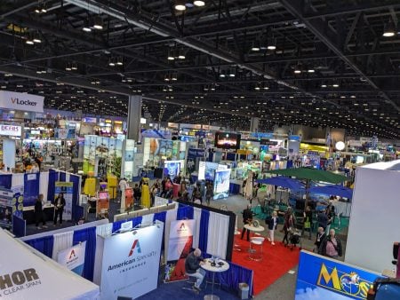 The trade show floor with lots of exhibitor booths