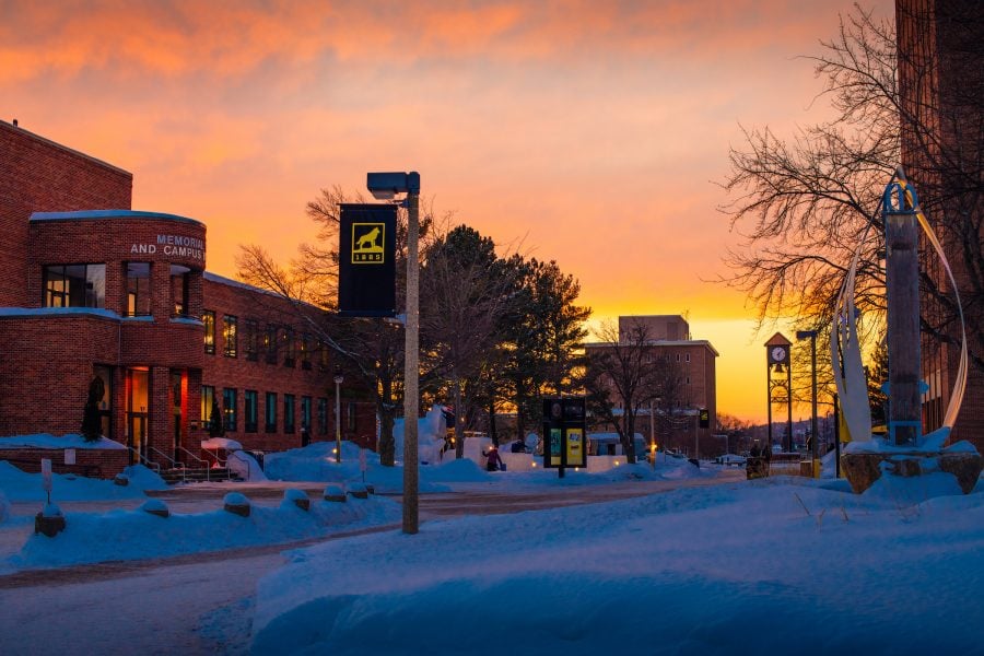 Winter campus with snow and sunset