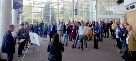 Students, faculty, and industry professionals gather in Samuel and Grace Horner Lobby of the Rozsa Center for the Performing Arts.