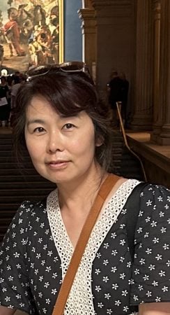 Taerin Chung poses wearing a black and white patterned blouse