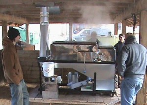 Michigan Tech Forestry and Environmental Resource Management (FERM) members tend the maple syrup evaporator, keeping the fire going, watching tap levels in the pans, making sure it does not boil over and drawing off the syrup.