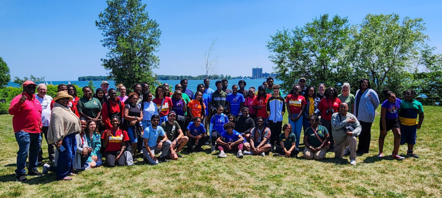 More than 50 students and instructors who participated in the SEED program pose together for a photo at a park in Detroit on a bright, sunny day.