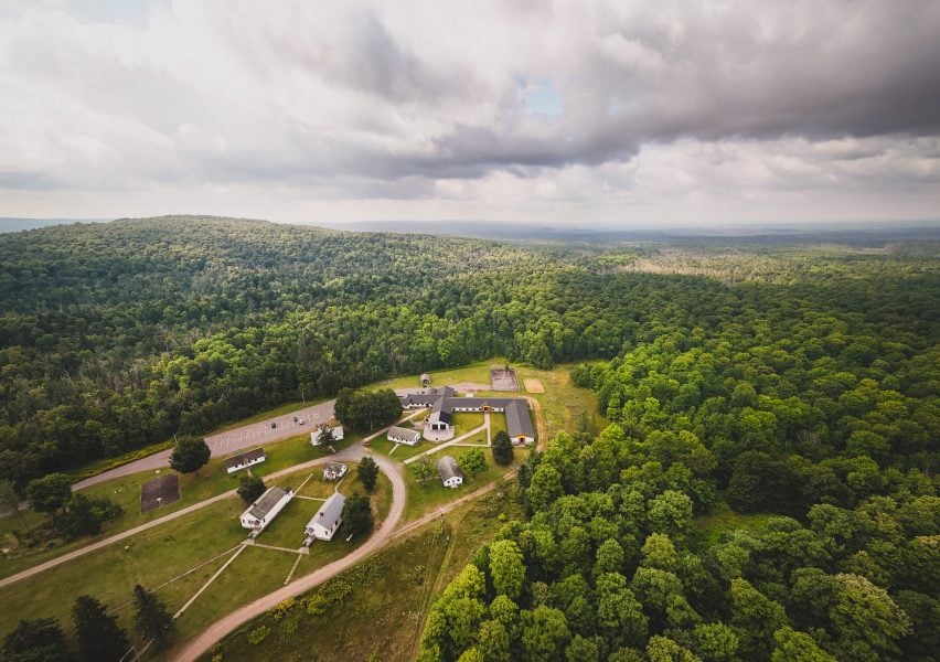 An aerial view of the Ford Center and surrounding forest.