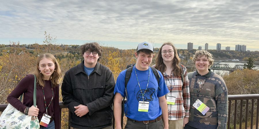 Michigan Tech Wildlife Society chapter members pose on a bridge outside of Edmonton, Alberta.