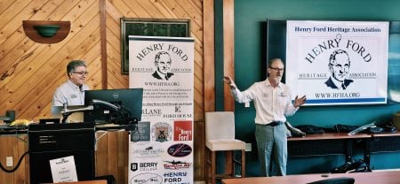 Two members of the Henry Ford Heritage Association give a presentation at the Ford Center.