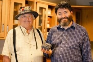 William “Bill” Rose and Rüdiger Escobar-Wolf with a sample of volcanic rock.