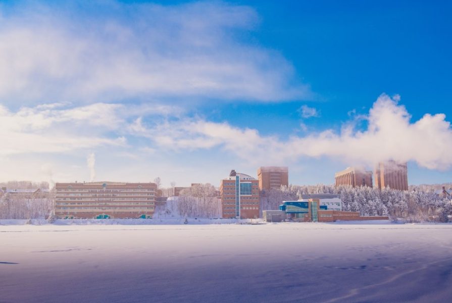 MTU campus viewed from across the frozen snow-covered canal.