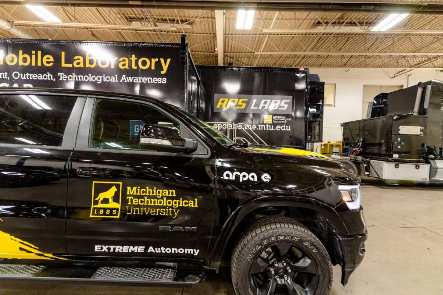 Black Michigan Tech truck on the floor at Advanced Power Systems (APS) Labs.