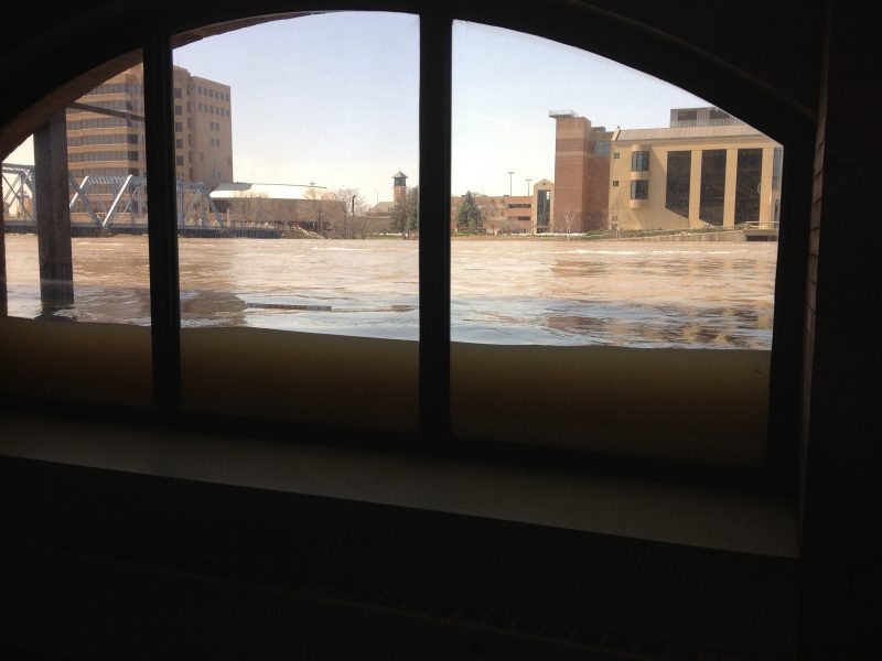 Flood waters as seen through an office building window.