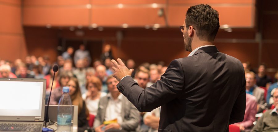 Speaker giving a talk on a public policy subject.