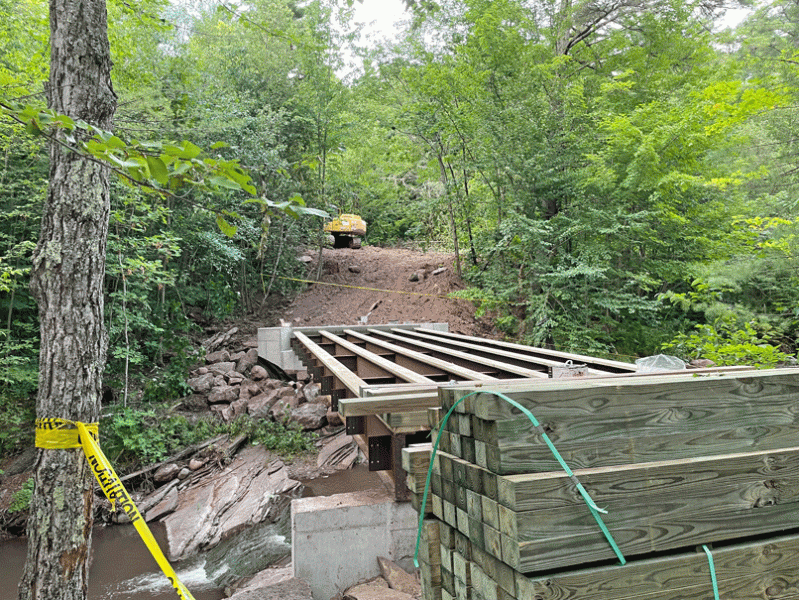 The beginning of constructing the middle bridge in the MH trail system.